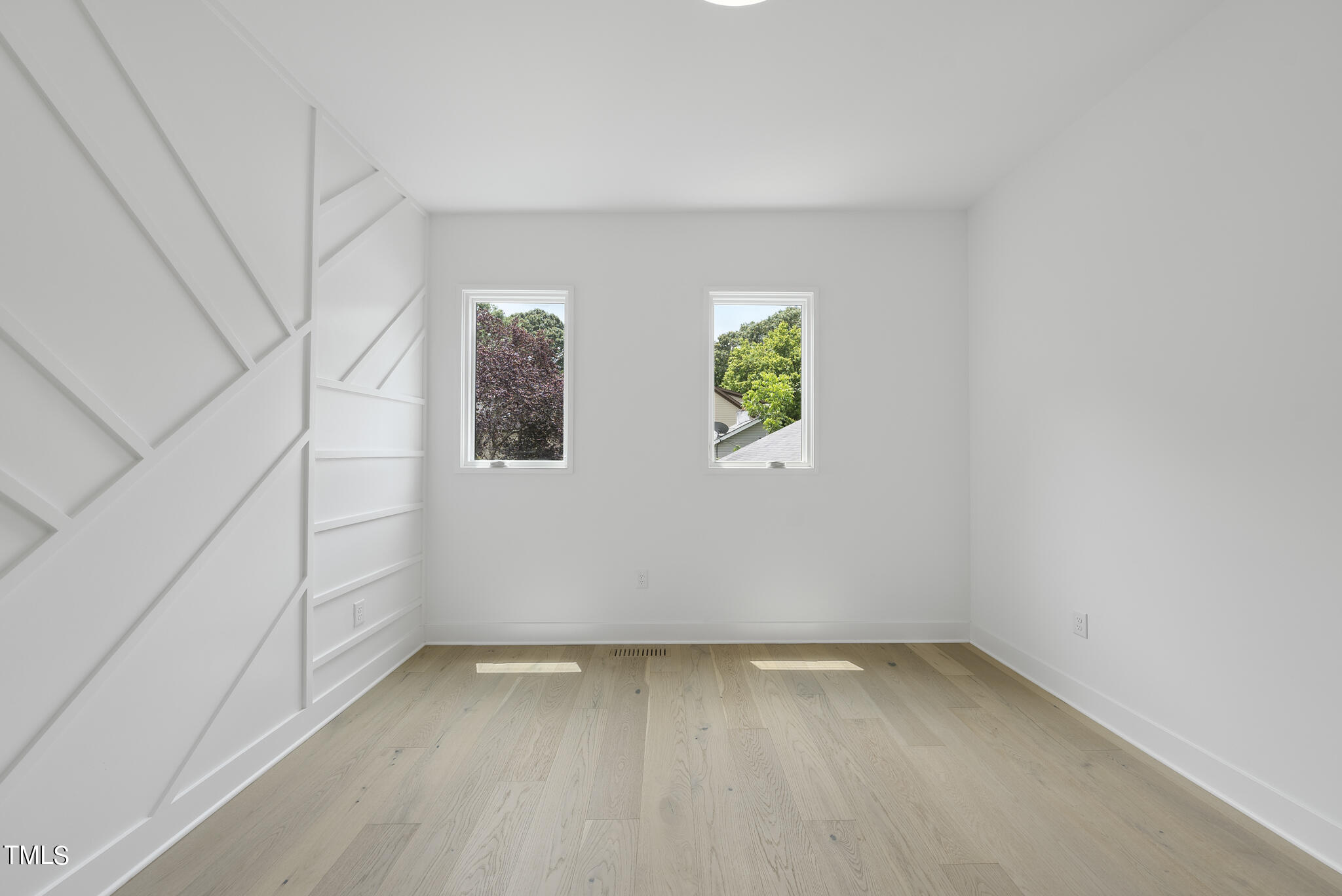 1012 Parker Street Raleigh, NC 27607 - Photo 31 of 39 a view of room with window and stairs