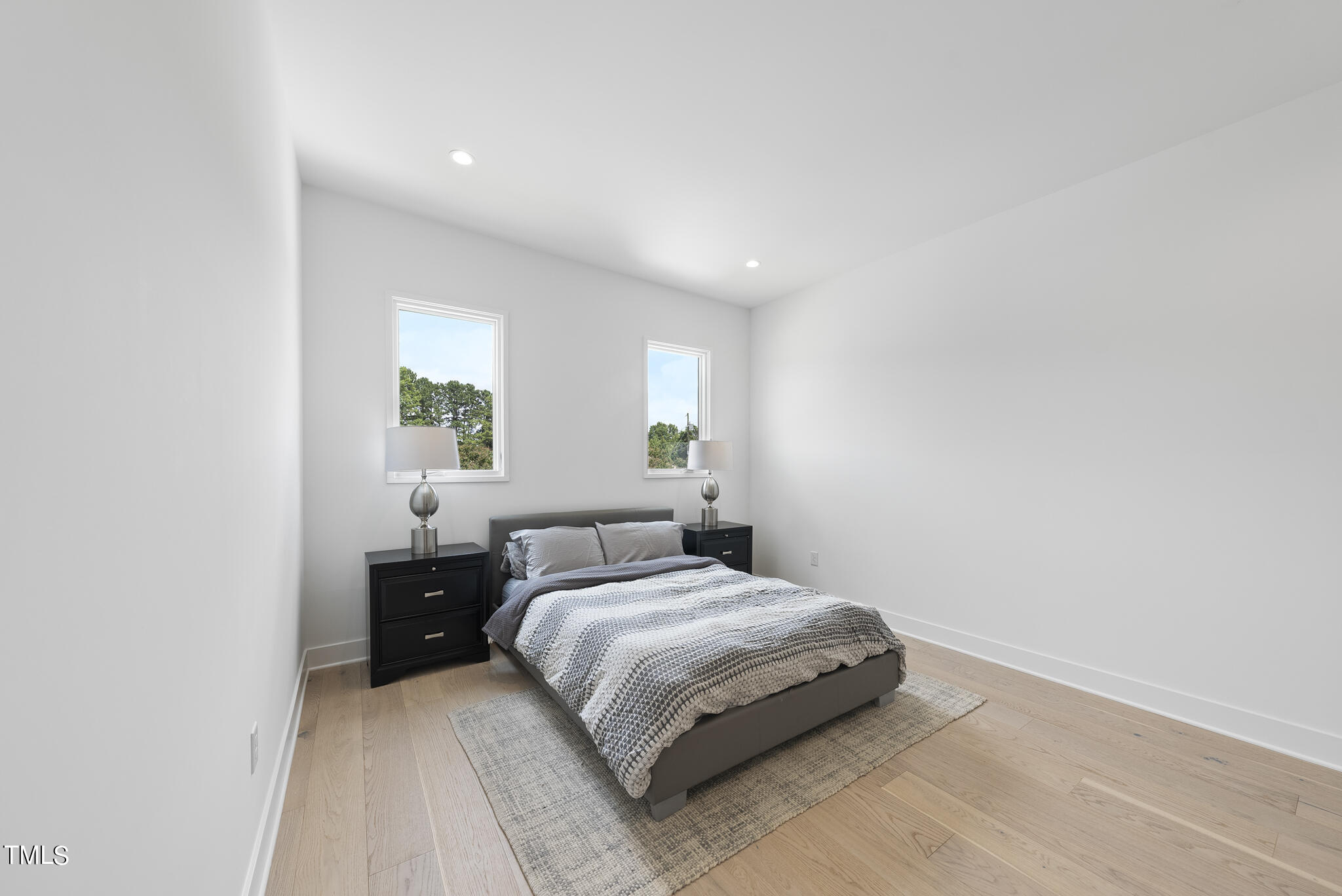 1012 Parker Street Raleigh, NC 27607 - Photo 32 of 39 a bedroom with a bed and a window