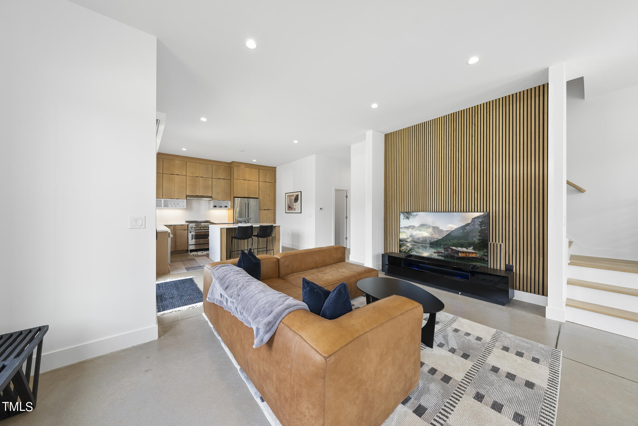 1012 Parker Street Raleigh, NC 27607 - Photo 4 of 39 a living room with furniture and a flat screen tv
