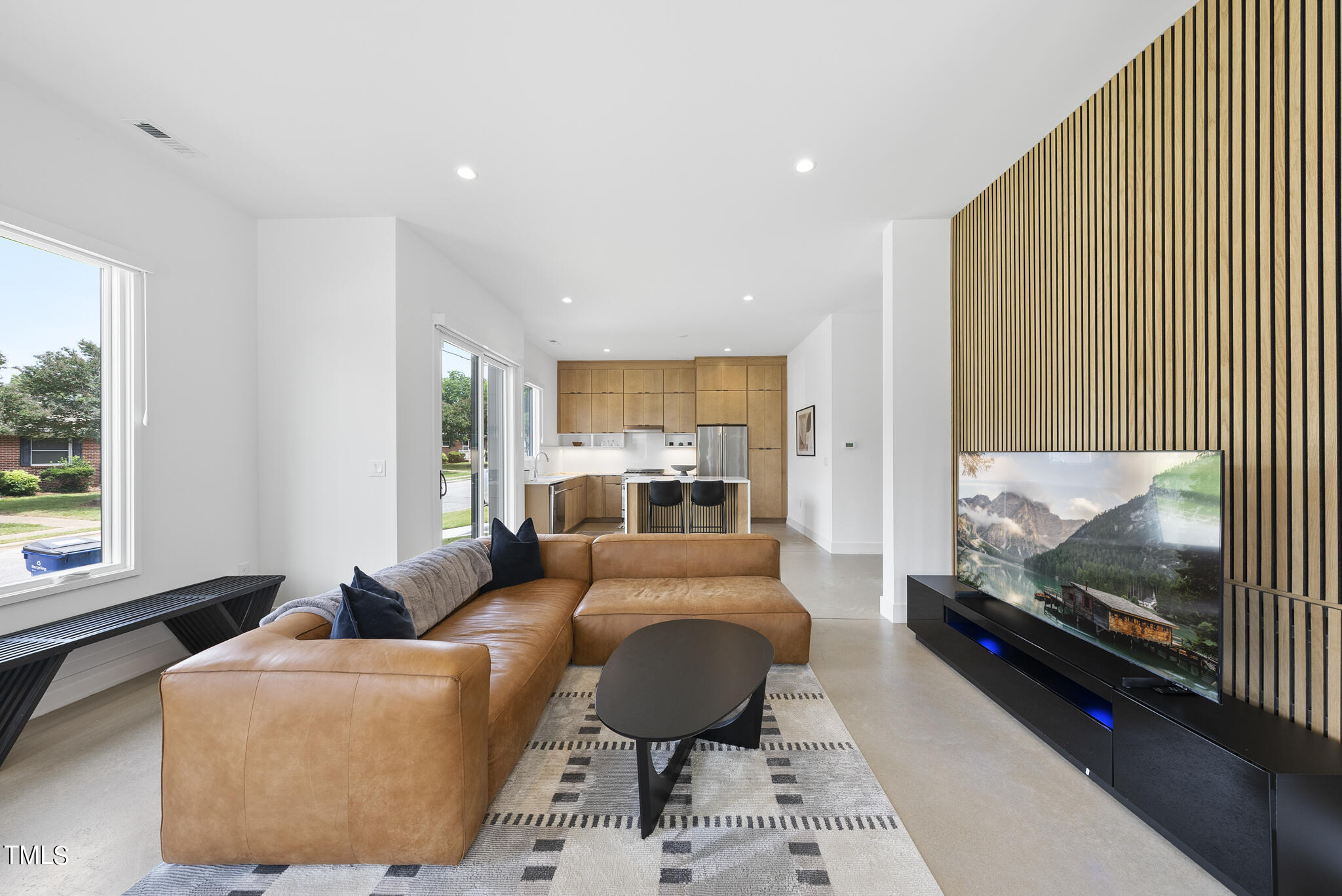 1012 Parker Street Raleigh, NC 27607 - Photo 5 of 39 a living room with furniture and a flat screen tv