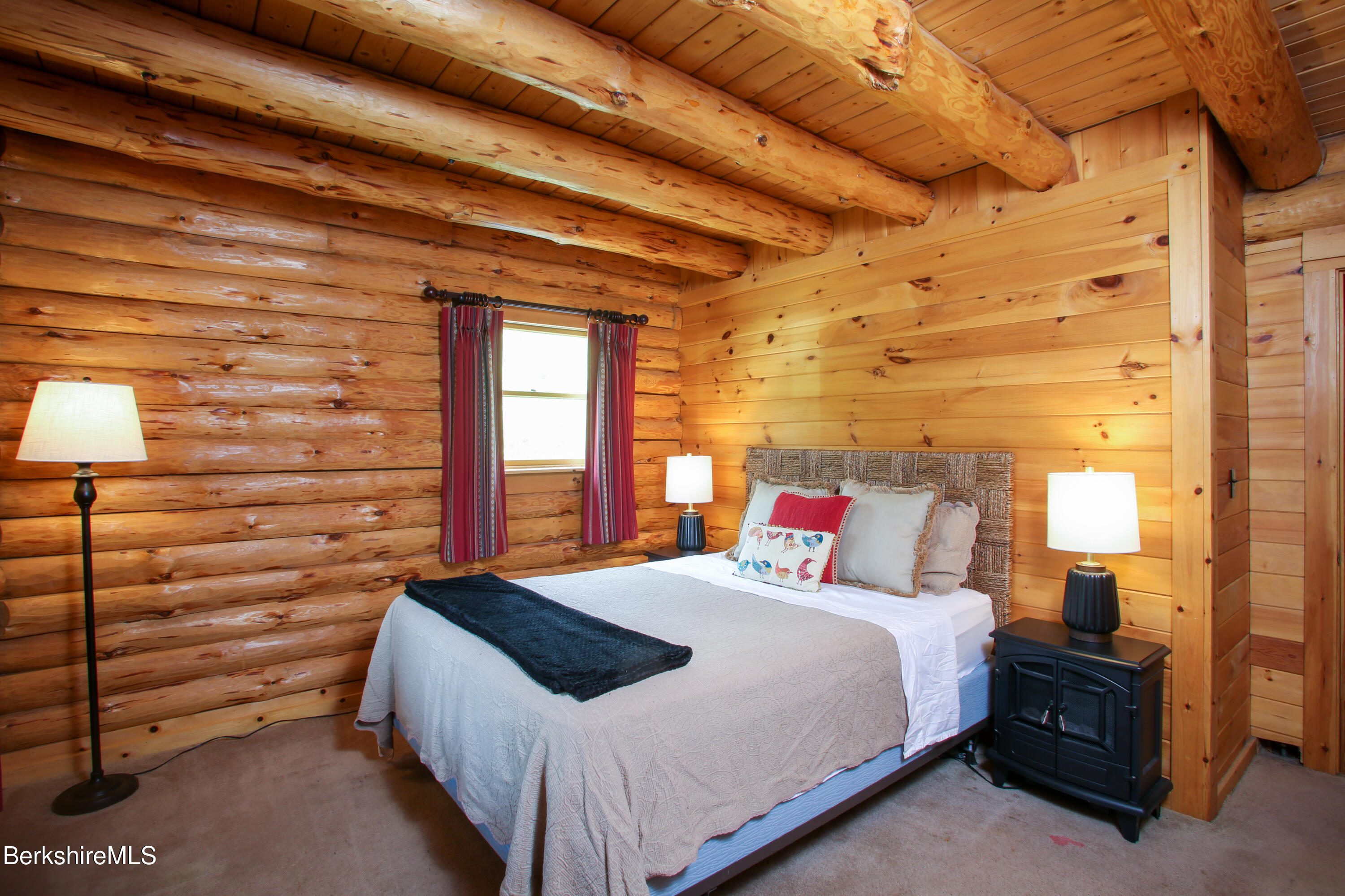 15 Stephanie Lane Peru, MA 01235 - Photo 17 of 37 a bedroom with a bed and a lamp