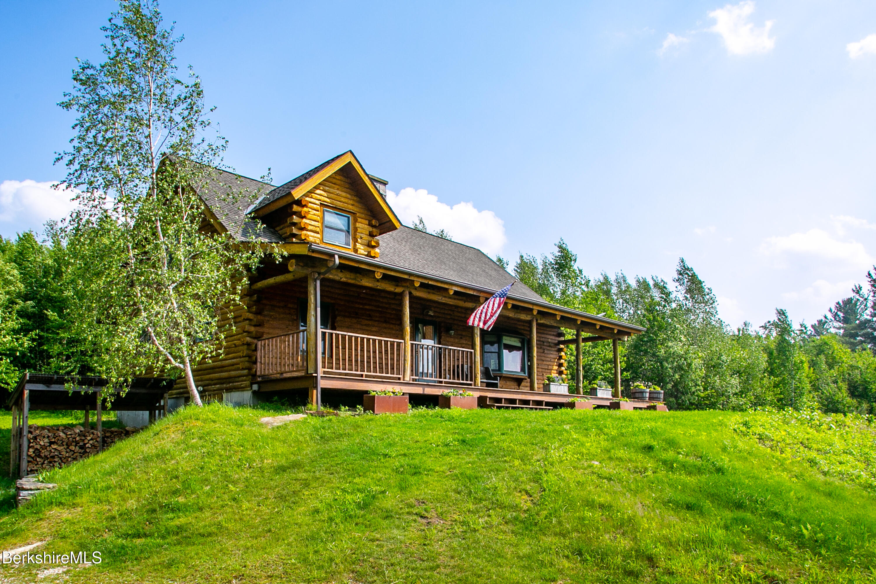 15 Stephanie Lane Peru, MA 01235 - Photo 2 of 37 a front view of a house with a yard