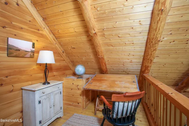 a bathroom with a sink a mirror and a shower