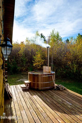a view of balcony with wooden floor and city view