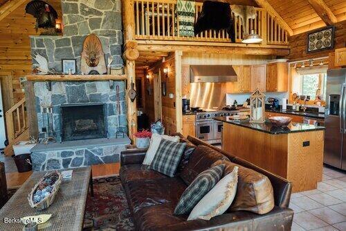 15 Stephanie Lane Peru, MA 01235 - Photo 8 of 37 a living room with furniture a fireplace and kitchen view