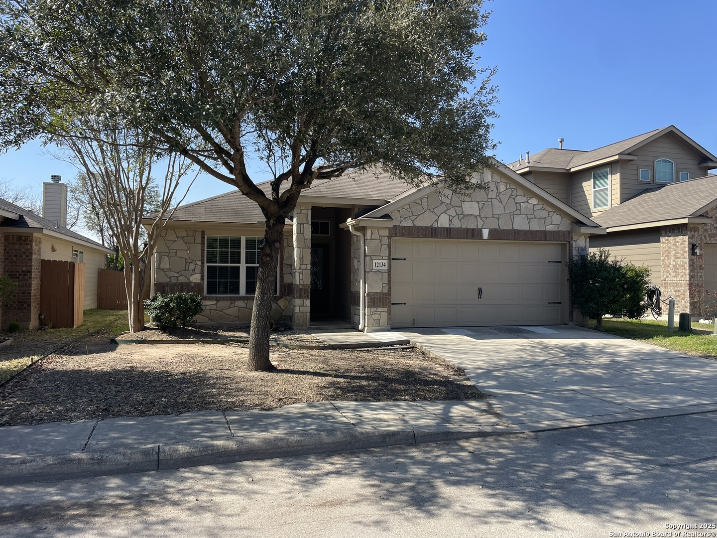 a house with yard in front of it