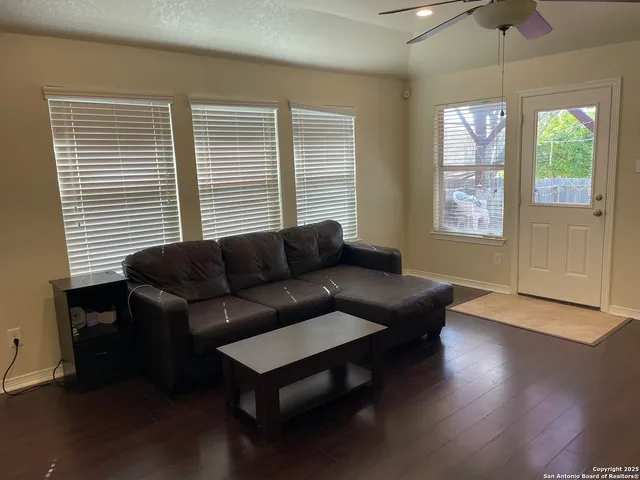 a living room with furniture and a window