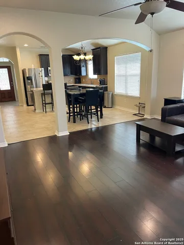 a view of a dining room with furniture and wooden floor
