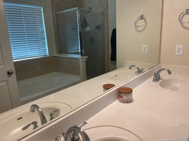 a bathroom with a tub and a sink
