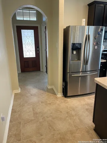 a view of an empty room and a window