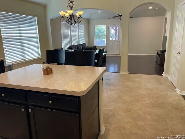a view of a dining room with furniture and window