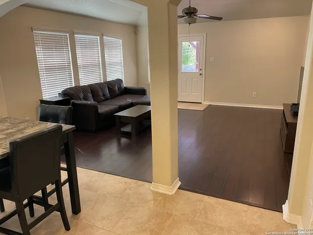 a living room with furniture and a large window