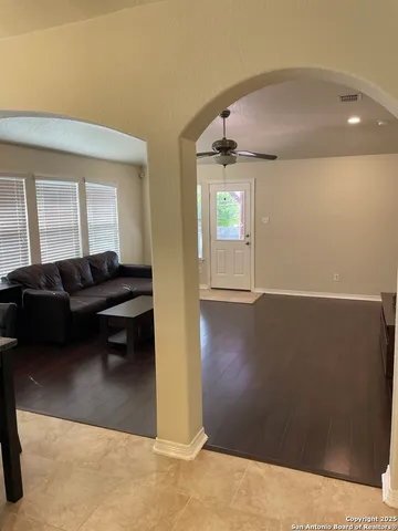 a living room with furniture and a window