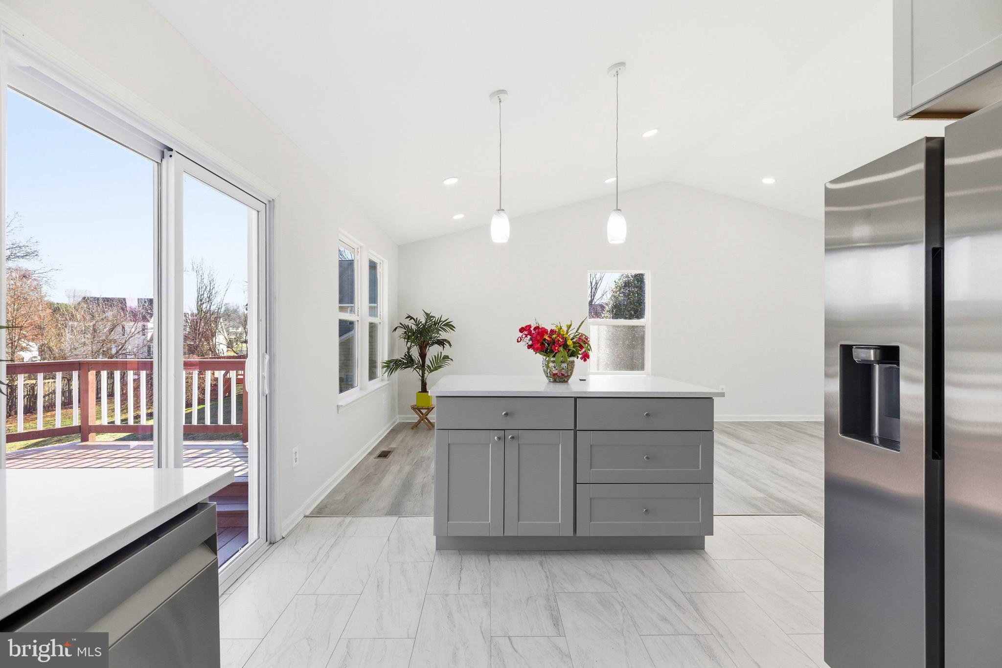 10395 Janja Court Manassas, VA 20110 - Photo 12 of 44 a kitchen with stainless steel appliances granite countertop a refrigerator and a sink