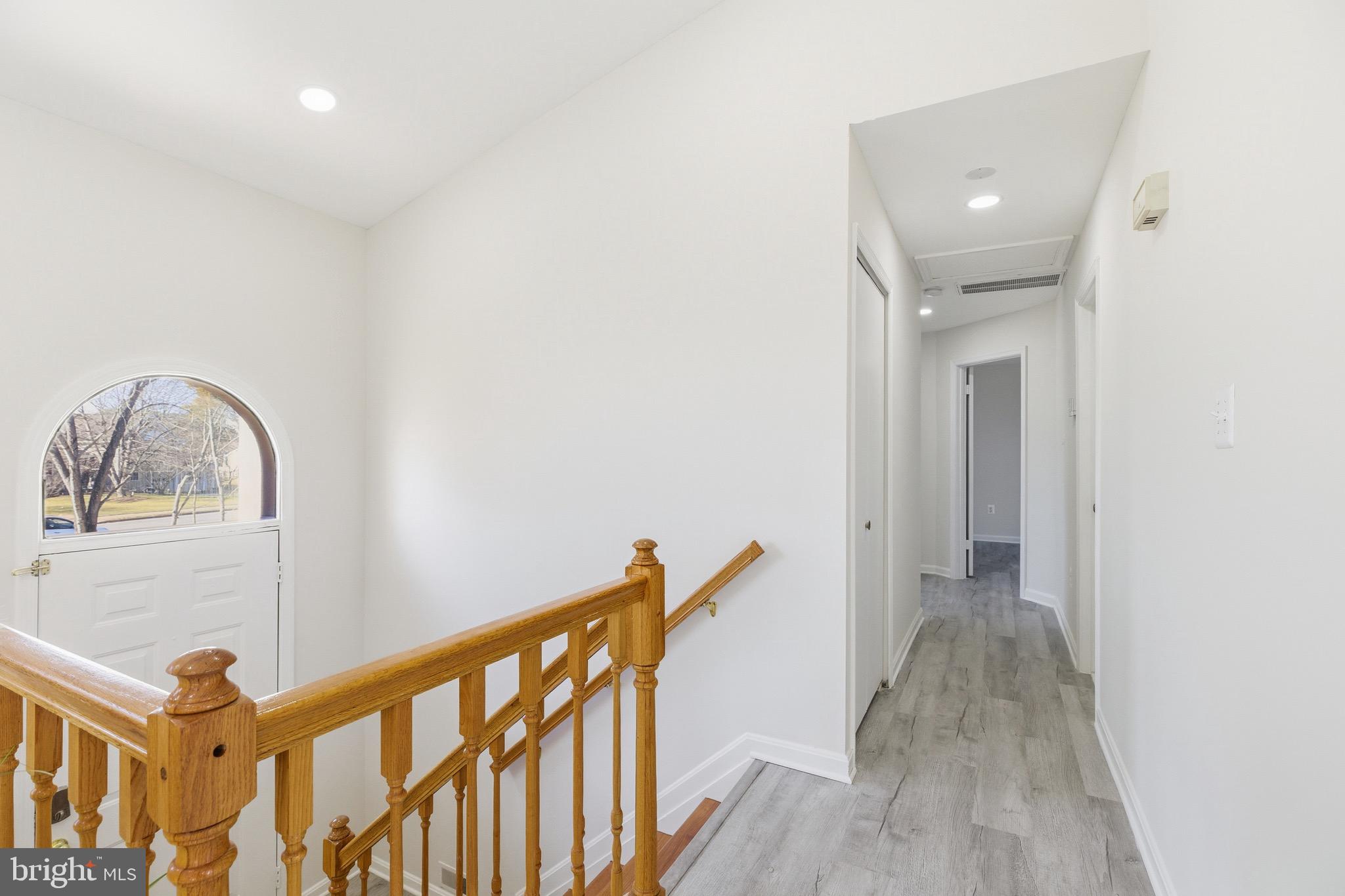 10395 Janja Court Manassas, VA 20110 - Photo 15 of 44 a view of a hallway with wooden floor and entryway