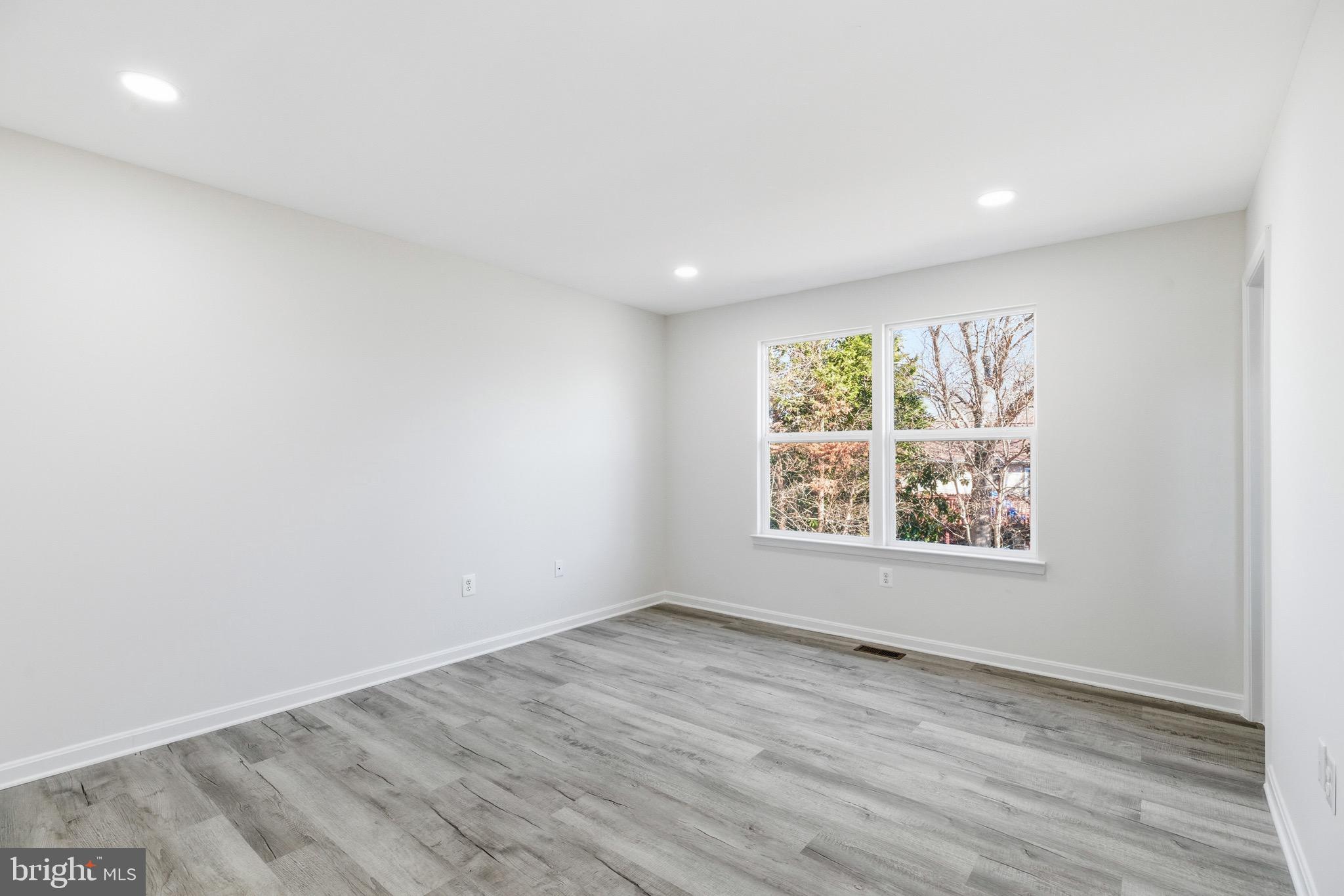 10395 Janja Court Manassas, VA 20110 - Photo 16 of 44 an empty room with wooden floor and window
