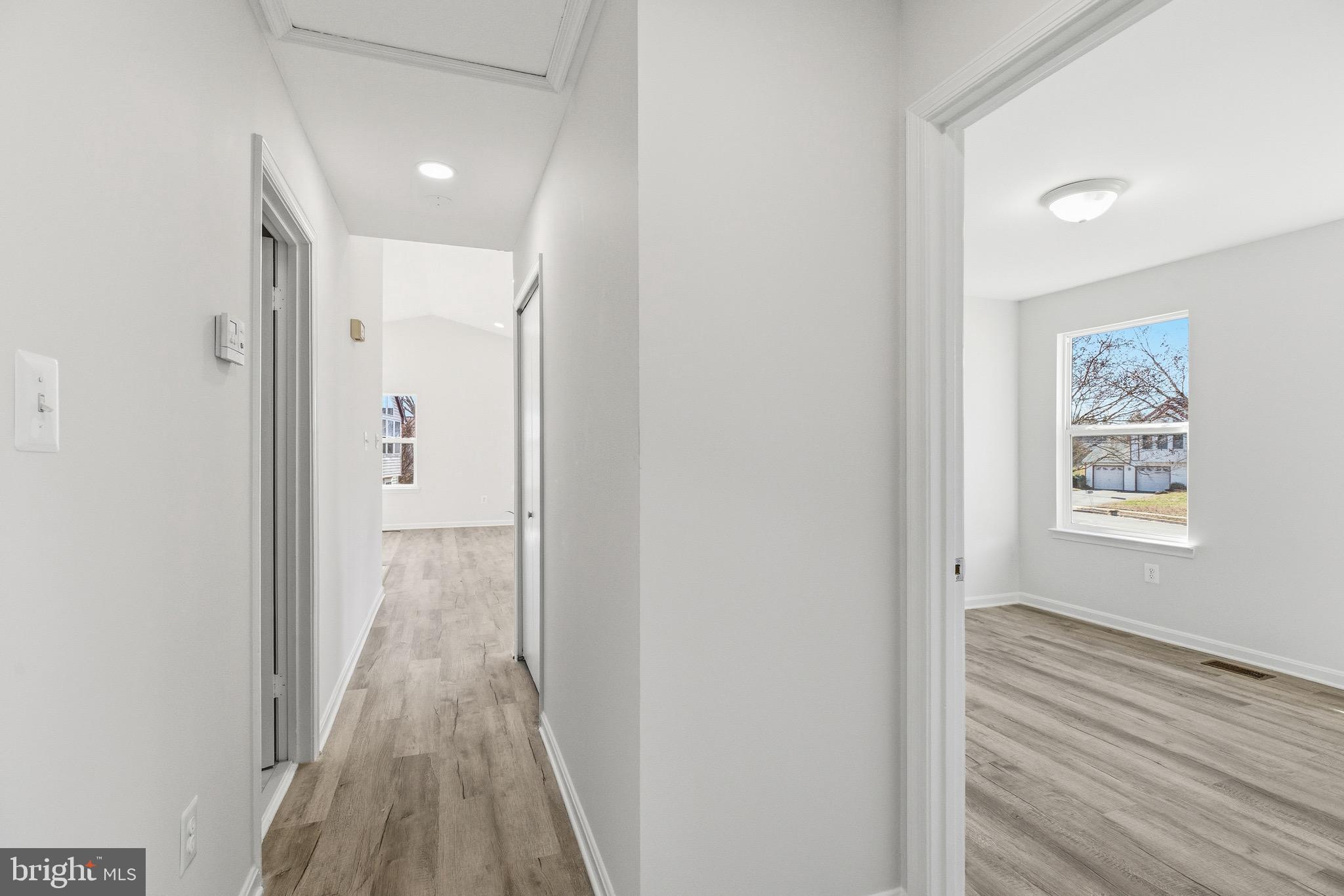 10395 Janja Court Manassas, VA 20110 - Photo 22 of 44 a view of a room with wooden floor bathroom and window