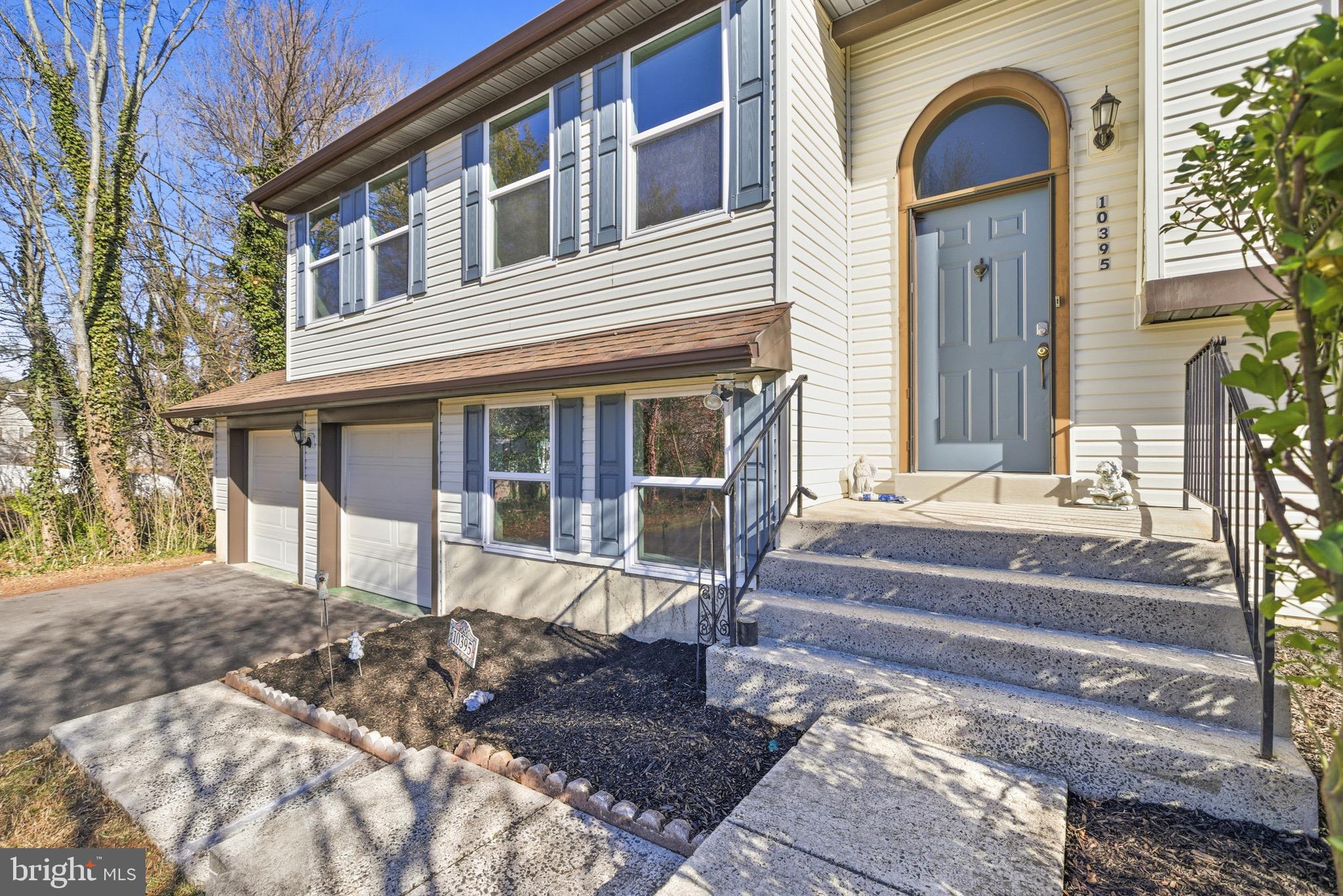 10395 Janja Court Manassas, VA 20110 - Photo 3 of 44 a front view of a house with a porch