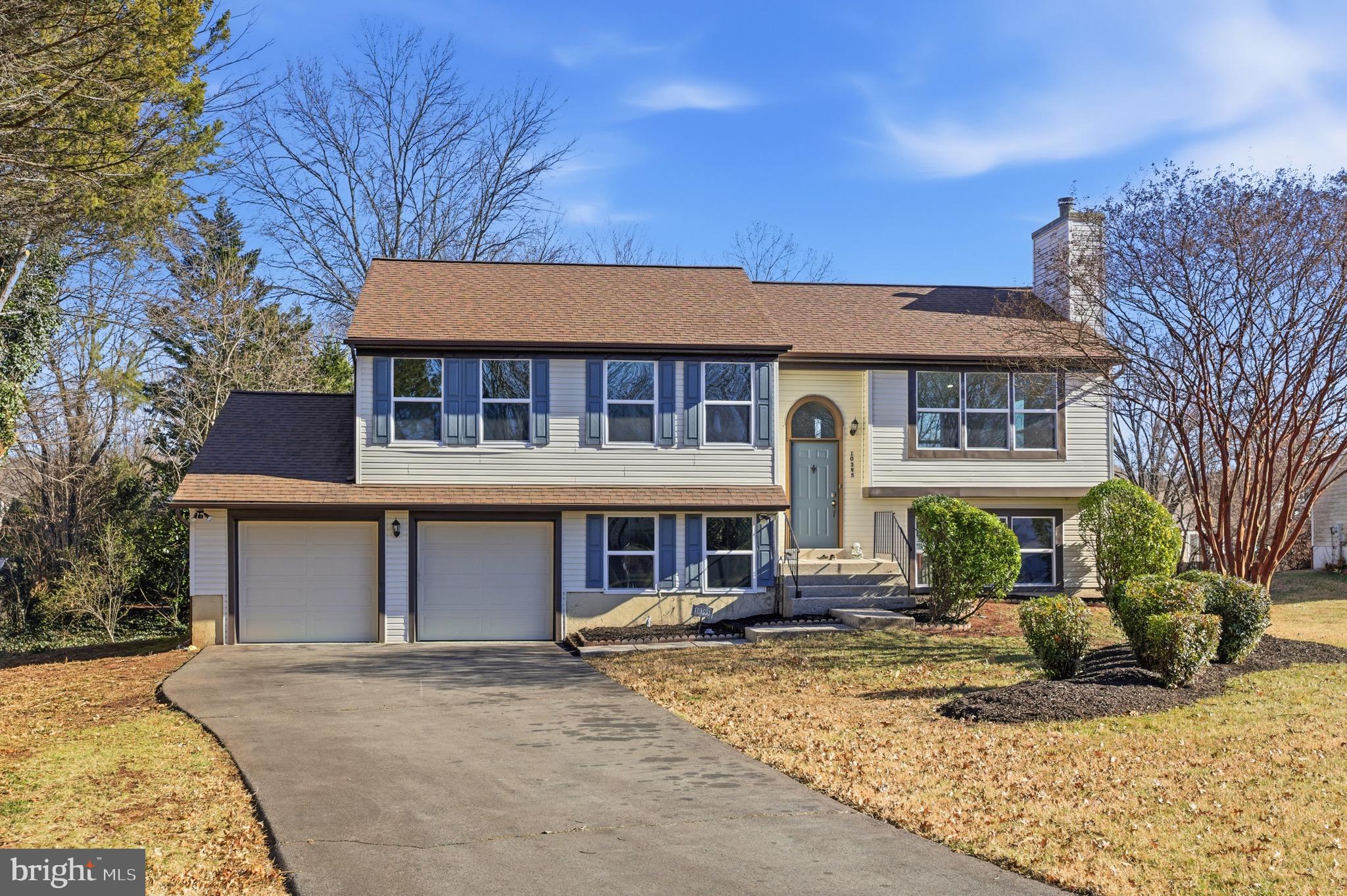 10395 Janja Court Manassas, VA 20110 - Photo 4 of 44 front view of a house with a yard