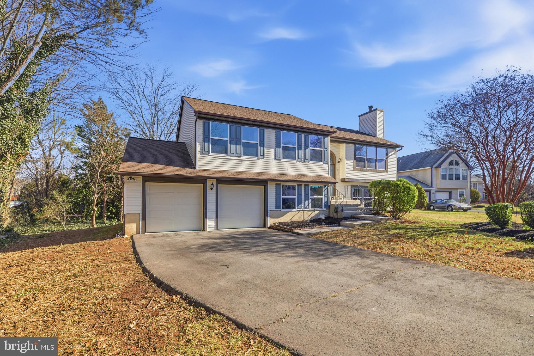 10395 Janja Court Manassas, VA 20110 - Photo 5 of 44 a view of a house with a yard and large tree