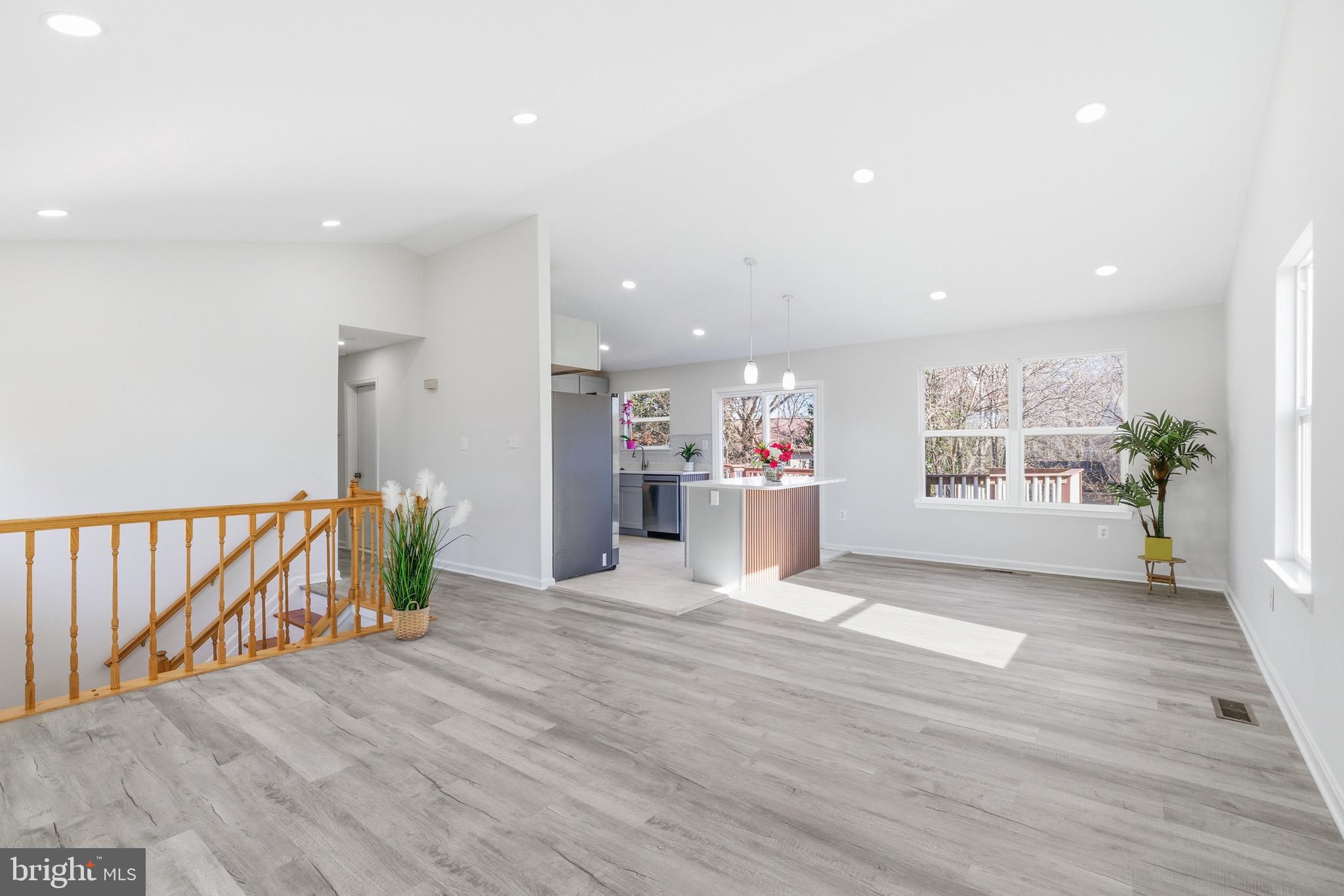 10395 Janja Court Manassas, VA 20110 - Photo 8 of 44 a view of an empty room with a window and wooden floor