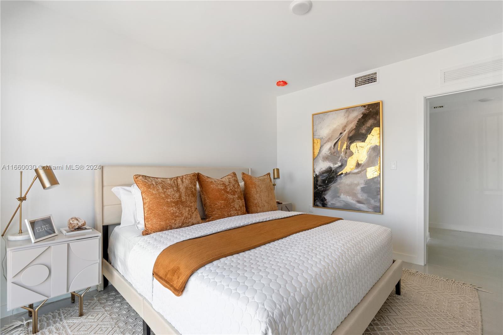 26119 Southwest 145th Court Homestead, FL 33033 - Photo 13 of 25 a bedroom with a bed and painting on the wall