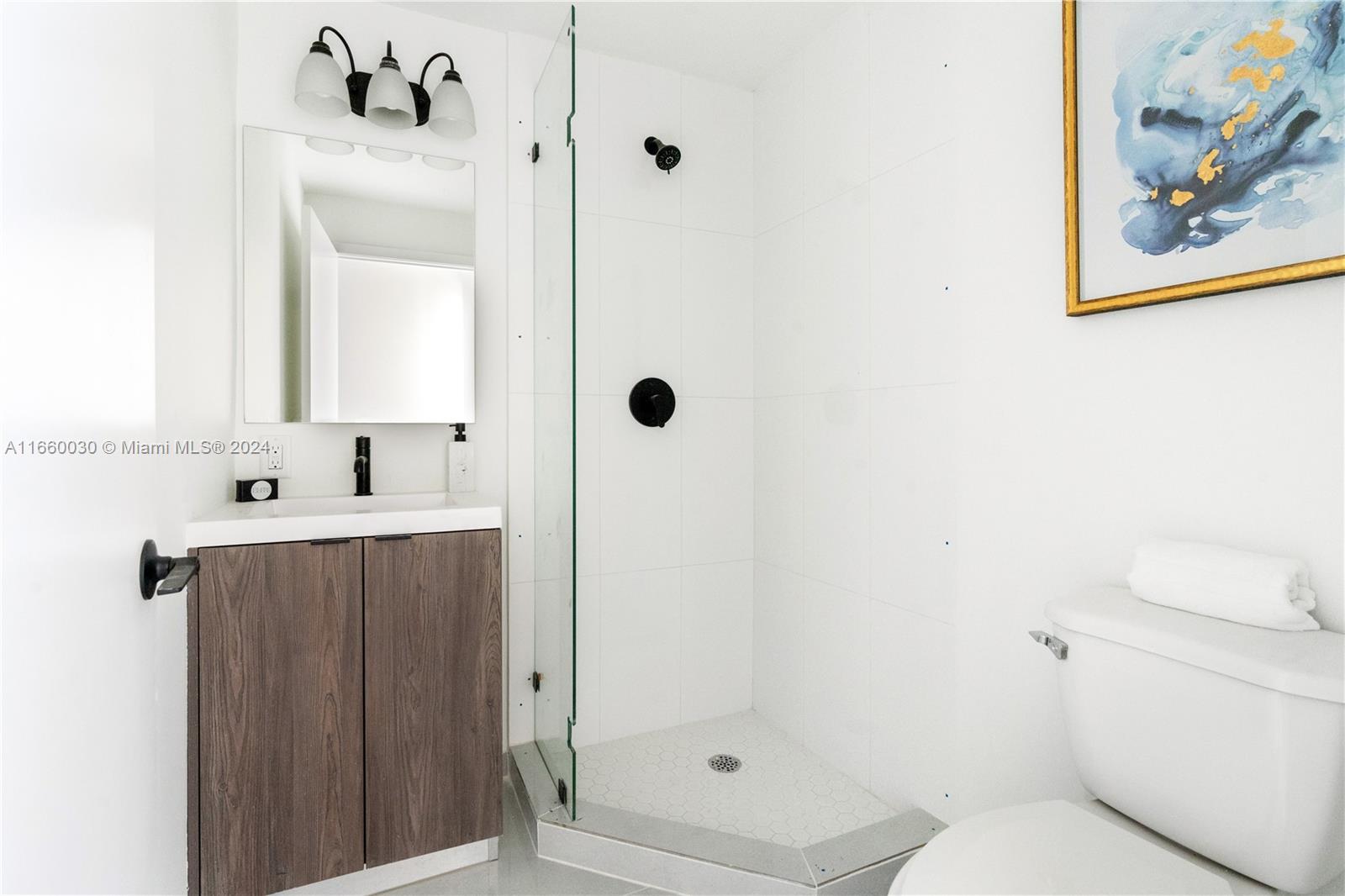 26119 Southwest 145th Court Homestead, FL 33033 - Photo 21 of 25 a bathroom with a sink a toilet and shower