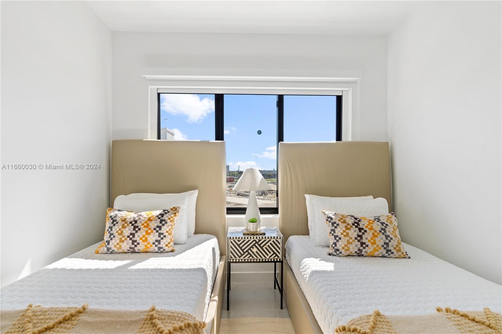 26119 Southwest 145th Court Homestead, FL 33033 - Photo 22 of 25 a bedroom with a bed and a couch