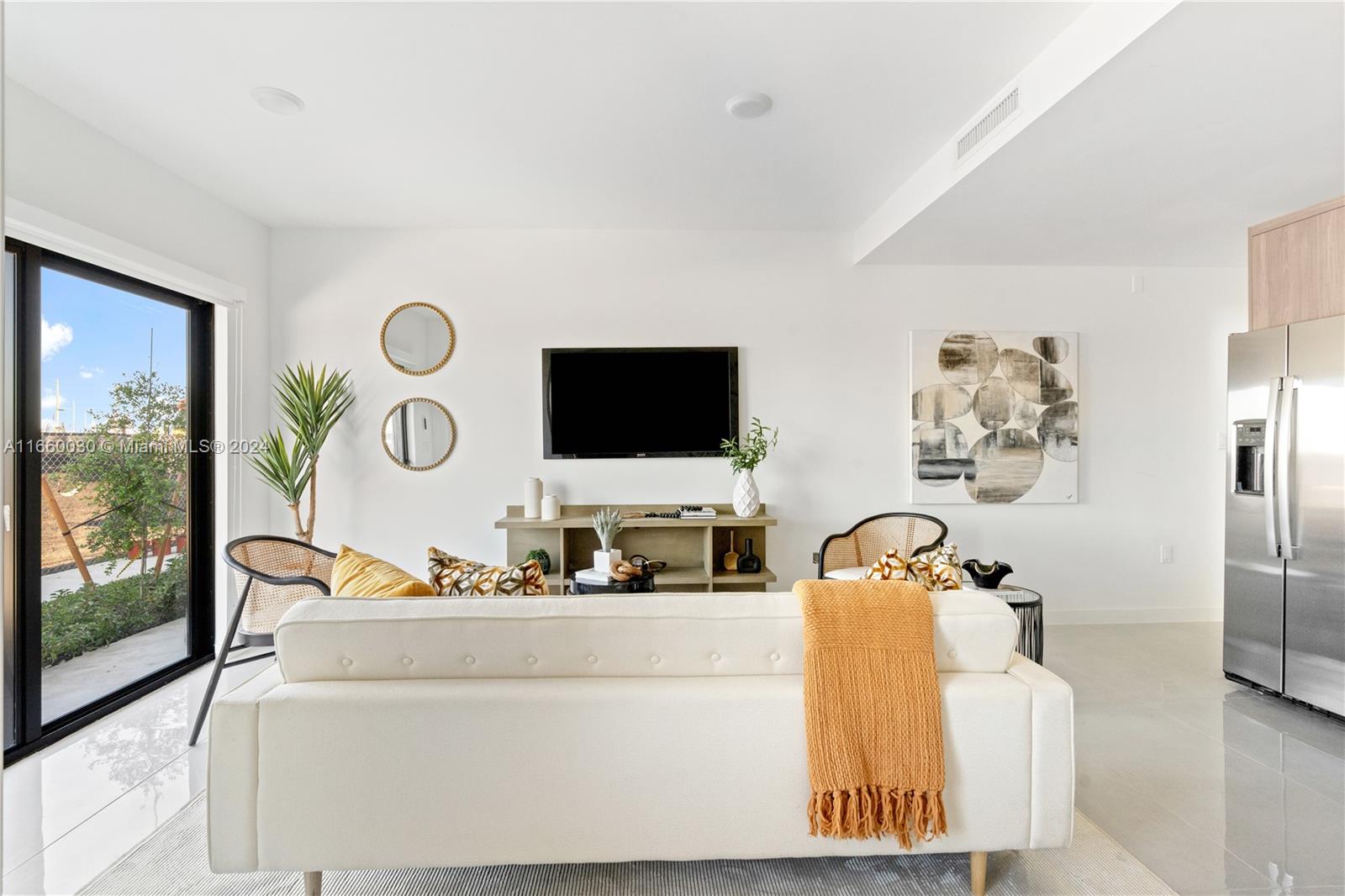 26119 Southwest 145th Court Homestead, FL 33033 - Photo 5 of 25 a living room with furniture and a flat screen tv