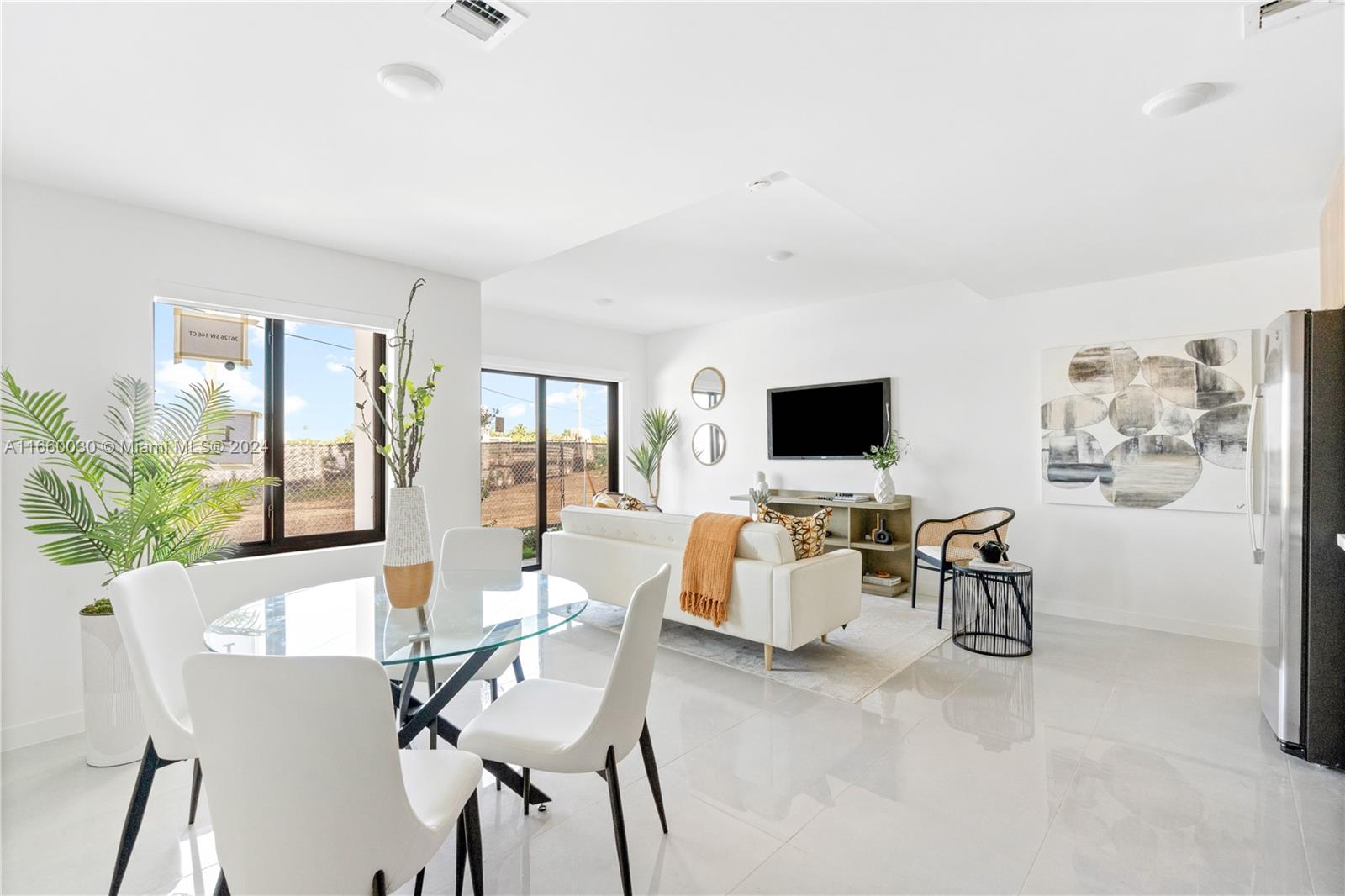 26119 Southwest 145th Court Homestead, FL 33033 - Photo 9 of 25 a view of a dining room with furniture window and outside view