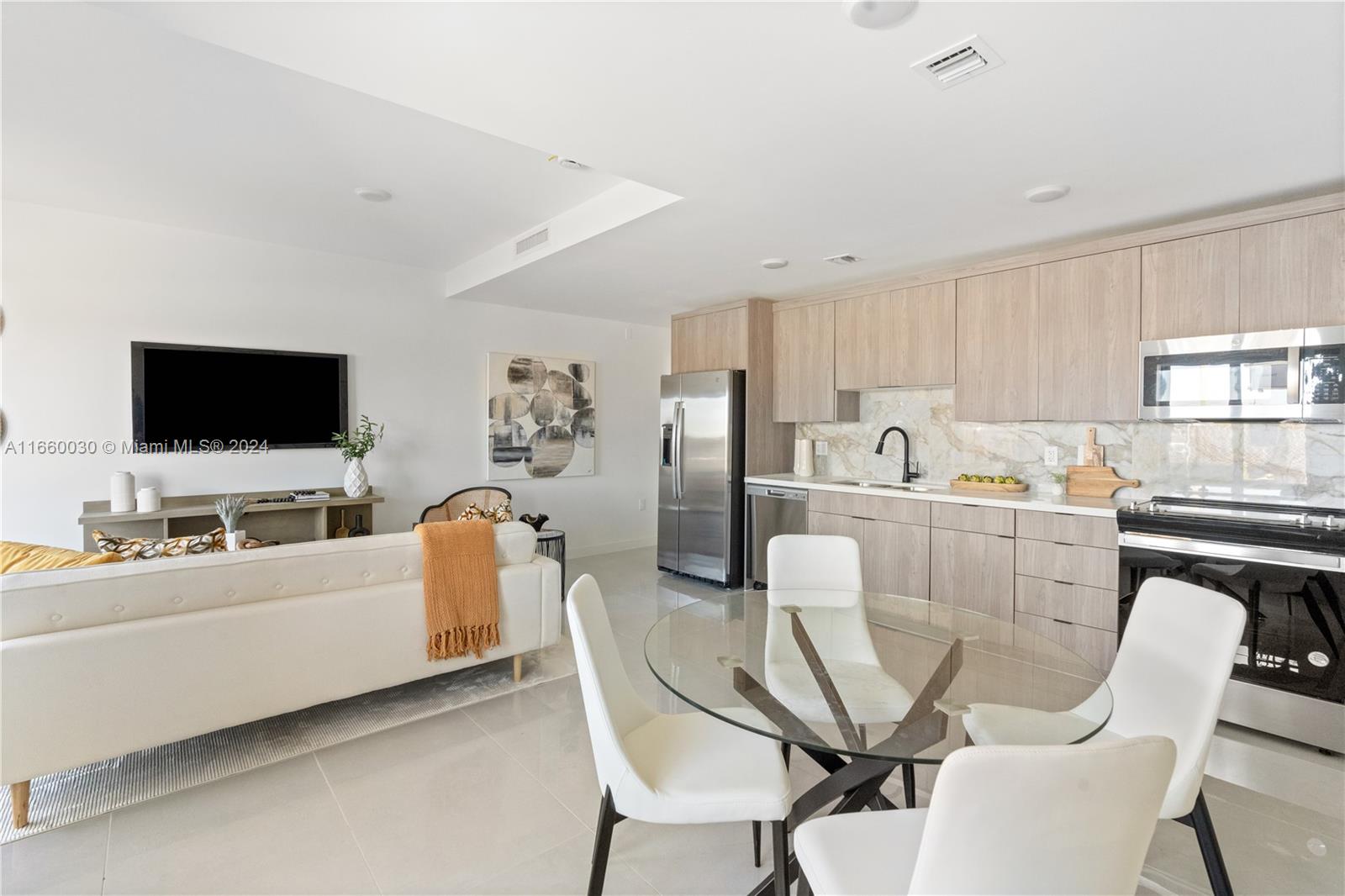 26119 Southwest 145th Court Homestead, FL 33033 - Photo 10 of 25 a living room with furniture and a flat screen tv