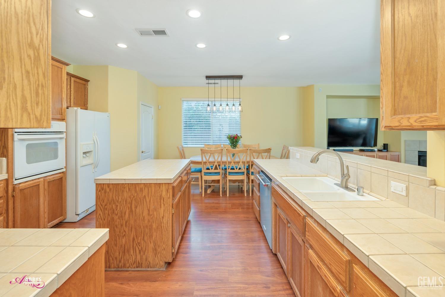 Undisclosed Address Bakersfield, CA 93312 - Photo 15 of 53 Kitchen looking into informal dining room