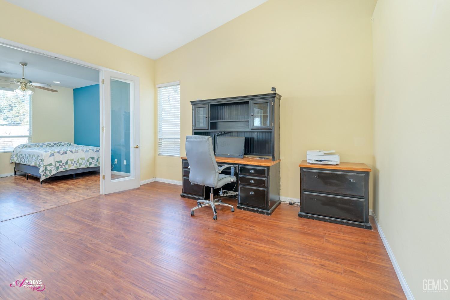 Undisclosed Address Bakersfield, CA 93312 - Photo 20 of 53 North end of living room looking into office/den with glass double doors