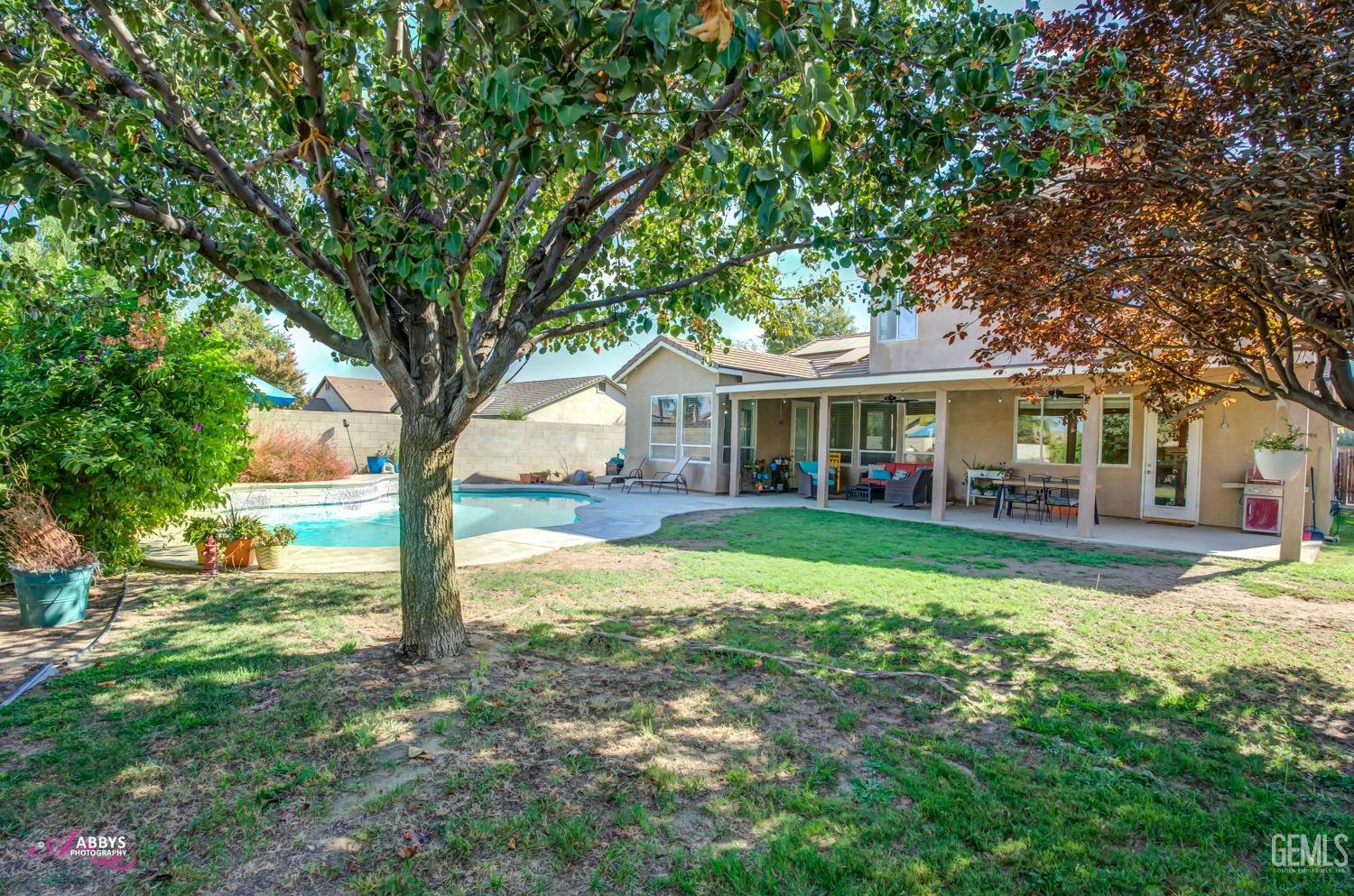 Undisclosed Address Bakersfield, CA 93312 - Photo 33 of 53 Nice shady backyard with pool