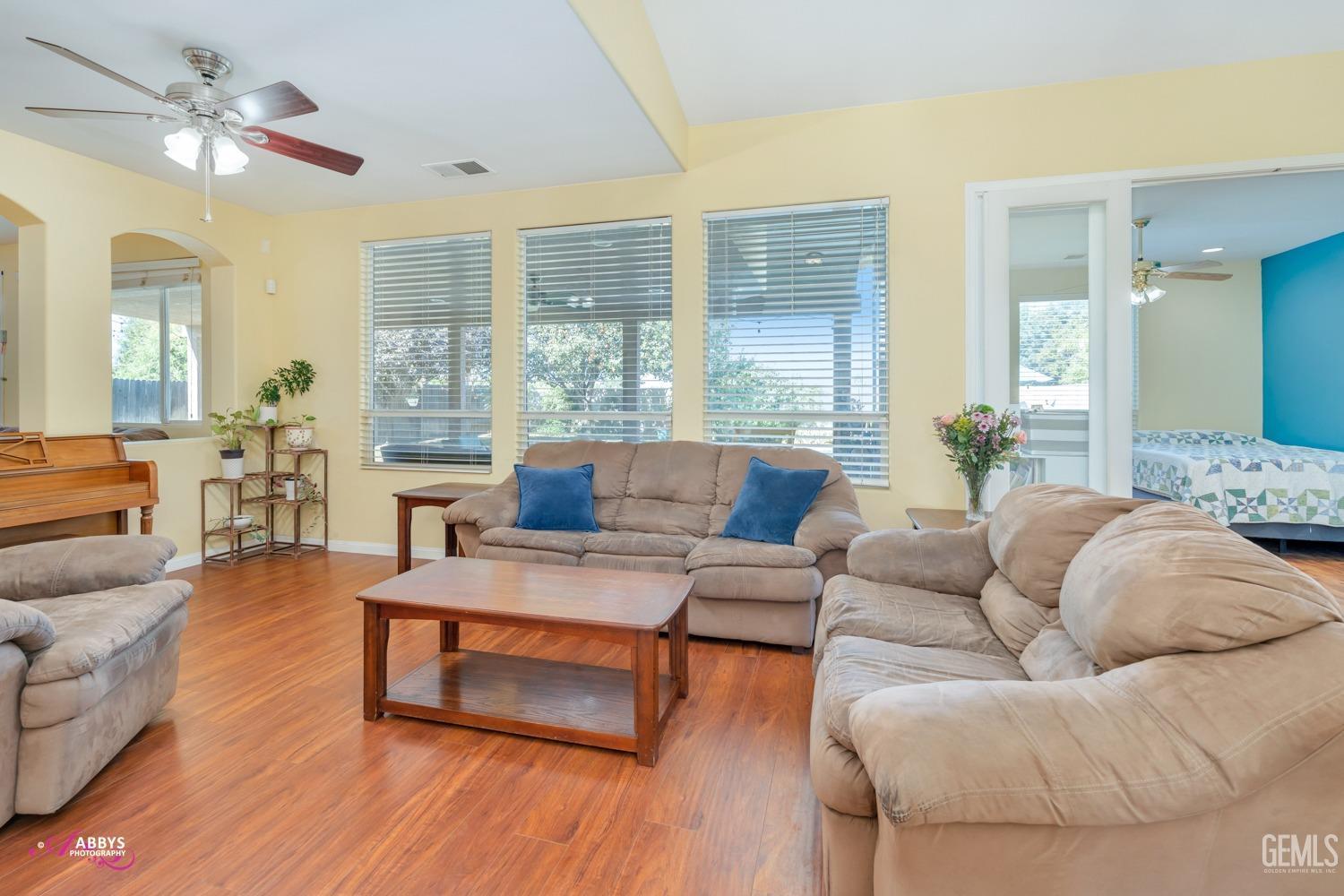 Undisclosed Address Bakersfield, CA 93312 - Photo 7 of 53 Formal living room - wood like floors throughout