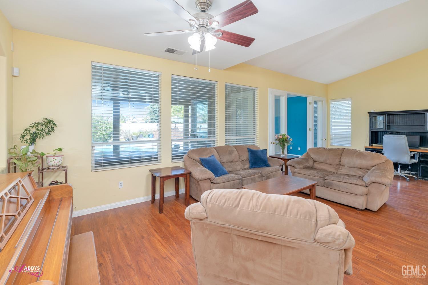 Undisclosed Address Bakersfield, CA 93312 - Photo 8 of 53 Formal living room/dining room = picture windows to backyard