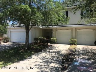 8612 Ribbon Falls Lane Jacksonville, FL 32244 - Photo 1 of 13 a backyard of a house with large trees and plants