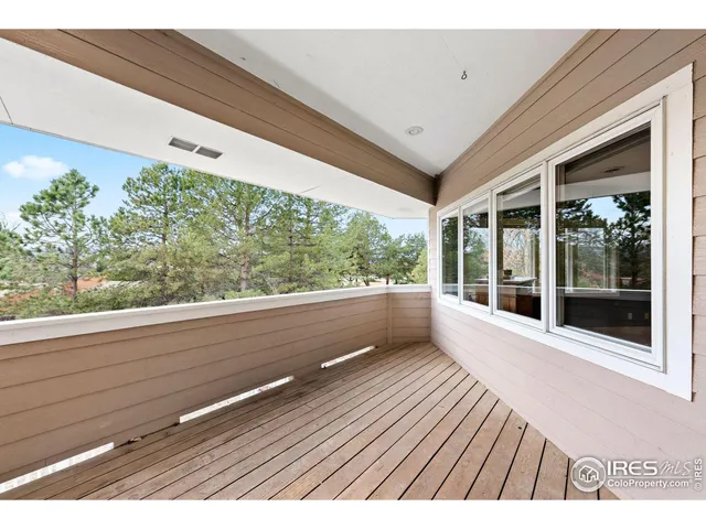 a view of balcony with furniture