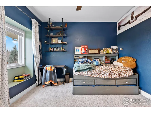 a bed room with furniture and a fireplace