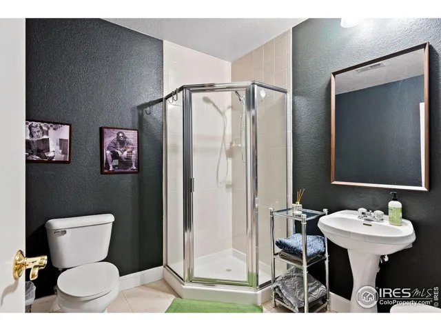 a view of a dinning table and chairs on the roof deck