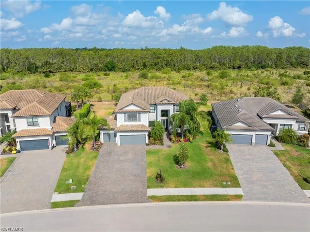 a view of houses with outdoor space and street view
