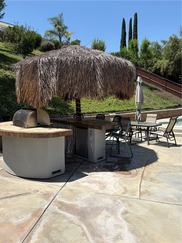 17115 Noble View Circle Riverside, CA 92503 - Photo 29 of 53 Built-in Bar-B-Q & small Fridge under a Palm Branch Palapa Cover.