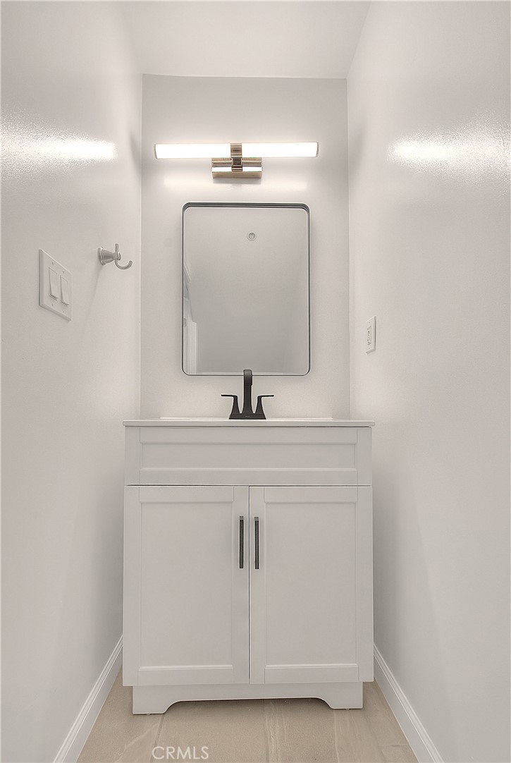 3105 Walton Avenue Los Angeles, CA 90007 - Photo 18 of 38 a bathroom with a sink and a mirror