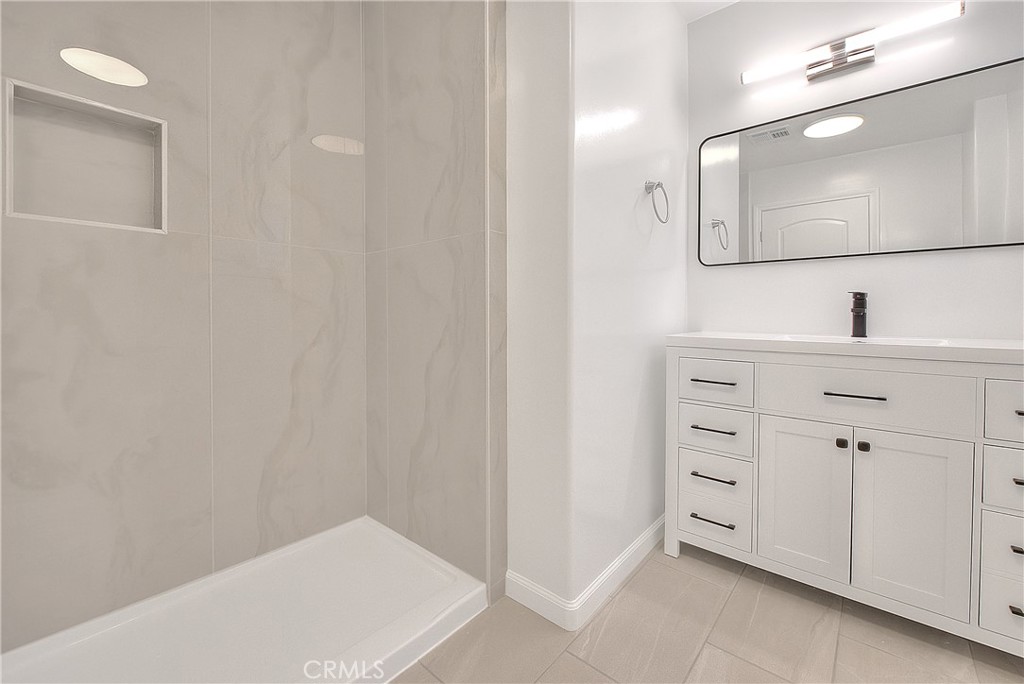 3105 Walton Avenue Los Angeles, CA 90007 - Photo 24 of 38 a bathroom with a sink and a mirror