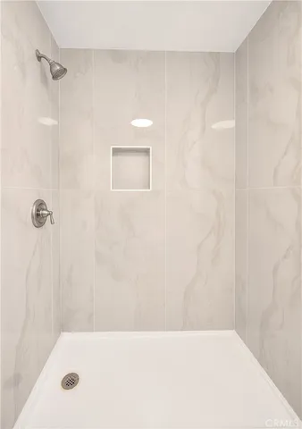 a kitchen with kitchen island a stove and a refrigerator