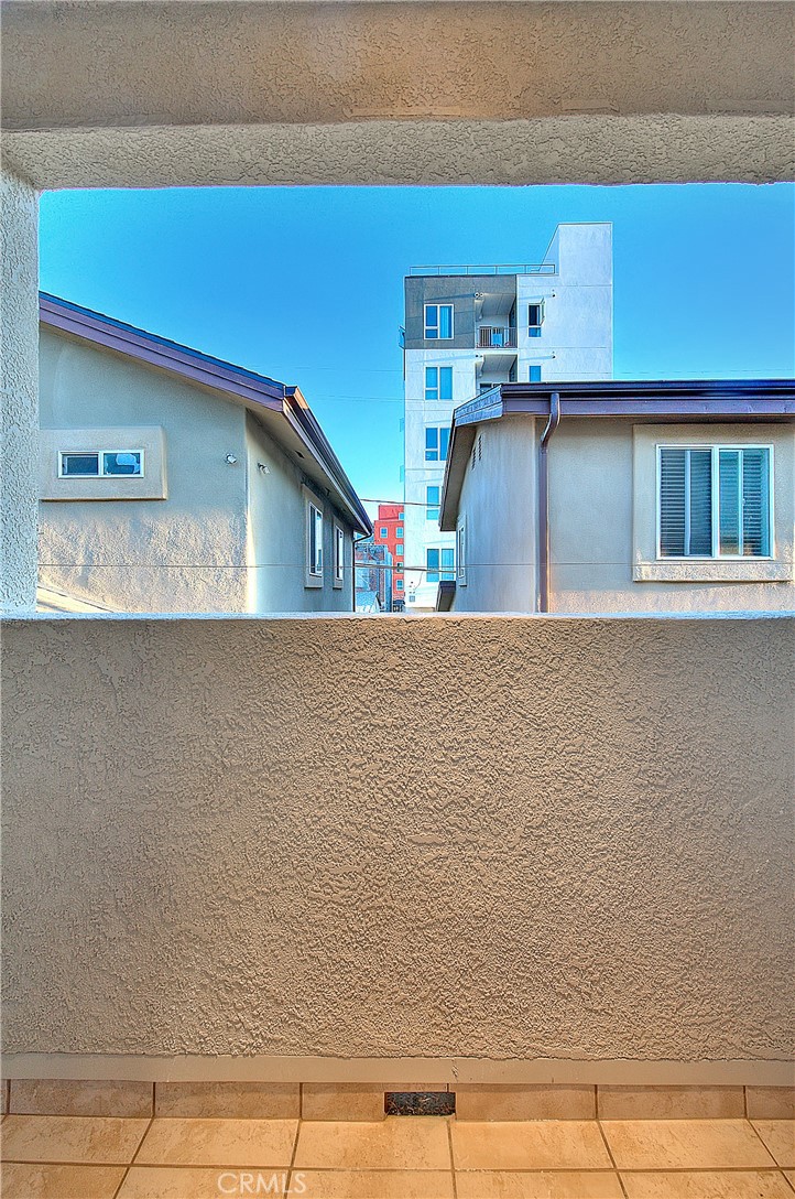3105 Walton Avenue Los Angeles, CA 90007 - Photo 26 of 38 a kitchen with kitchen island a stove and a refrigerator