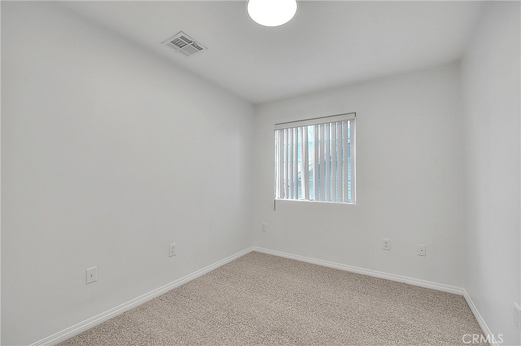 3105 Walton Avenue Los Angeles, CA 90007 - Photo 28 of 38 an empty room with a window