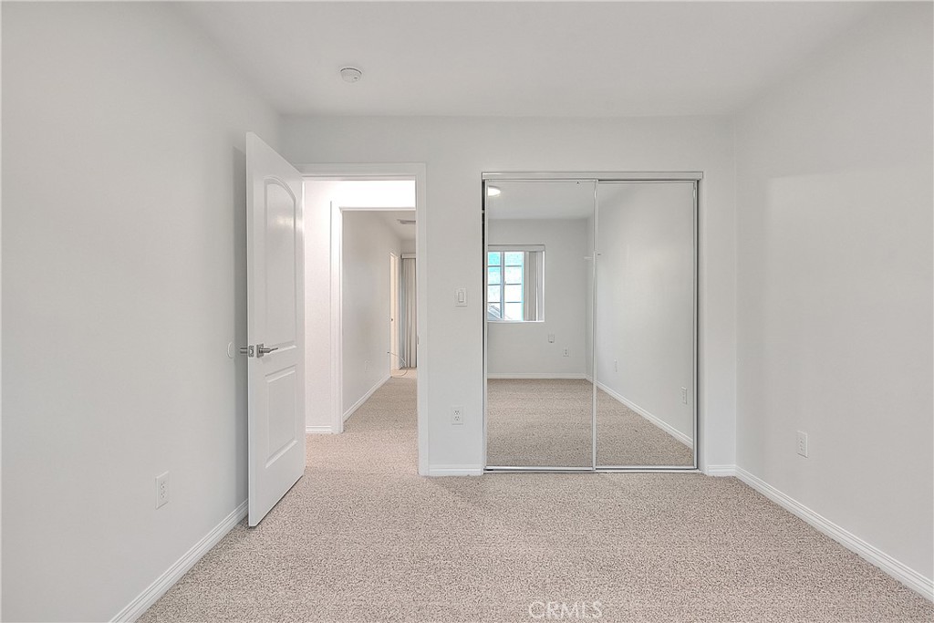 3105 Walton Avenue Los Angeles, CA 90007 - Photo 34 of 38 an empty room with windows and wooden floor