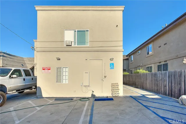 a view of a car park in front of house