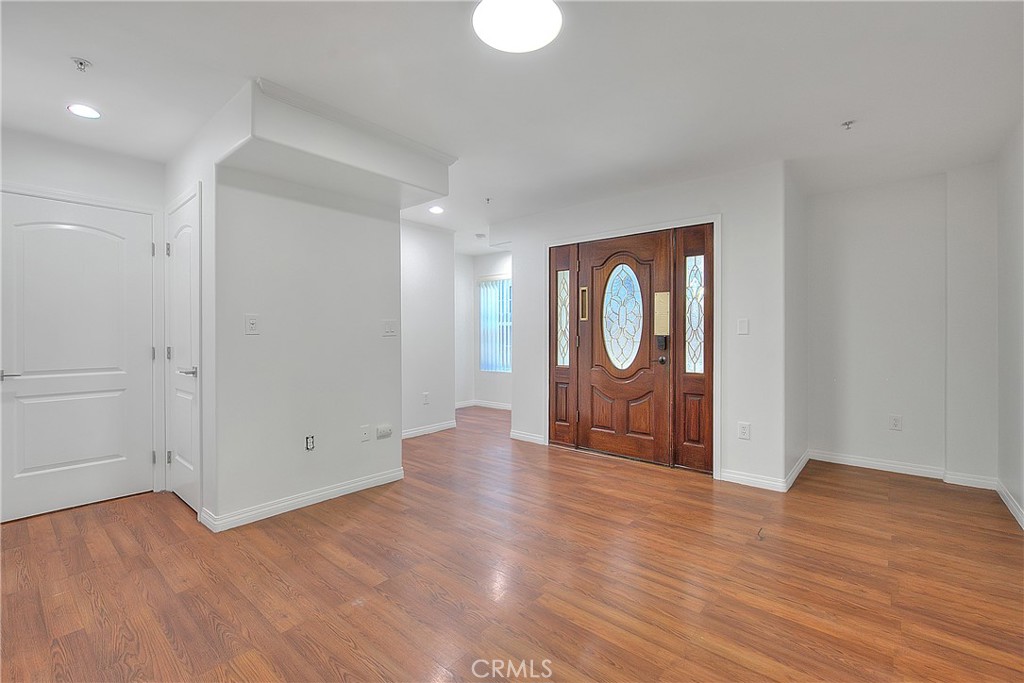 3105 Walton Avenue Los Angeles, CA 90007 - Photo 4 of 38 a view of a room with wooden floor and window